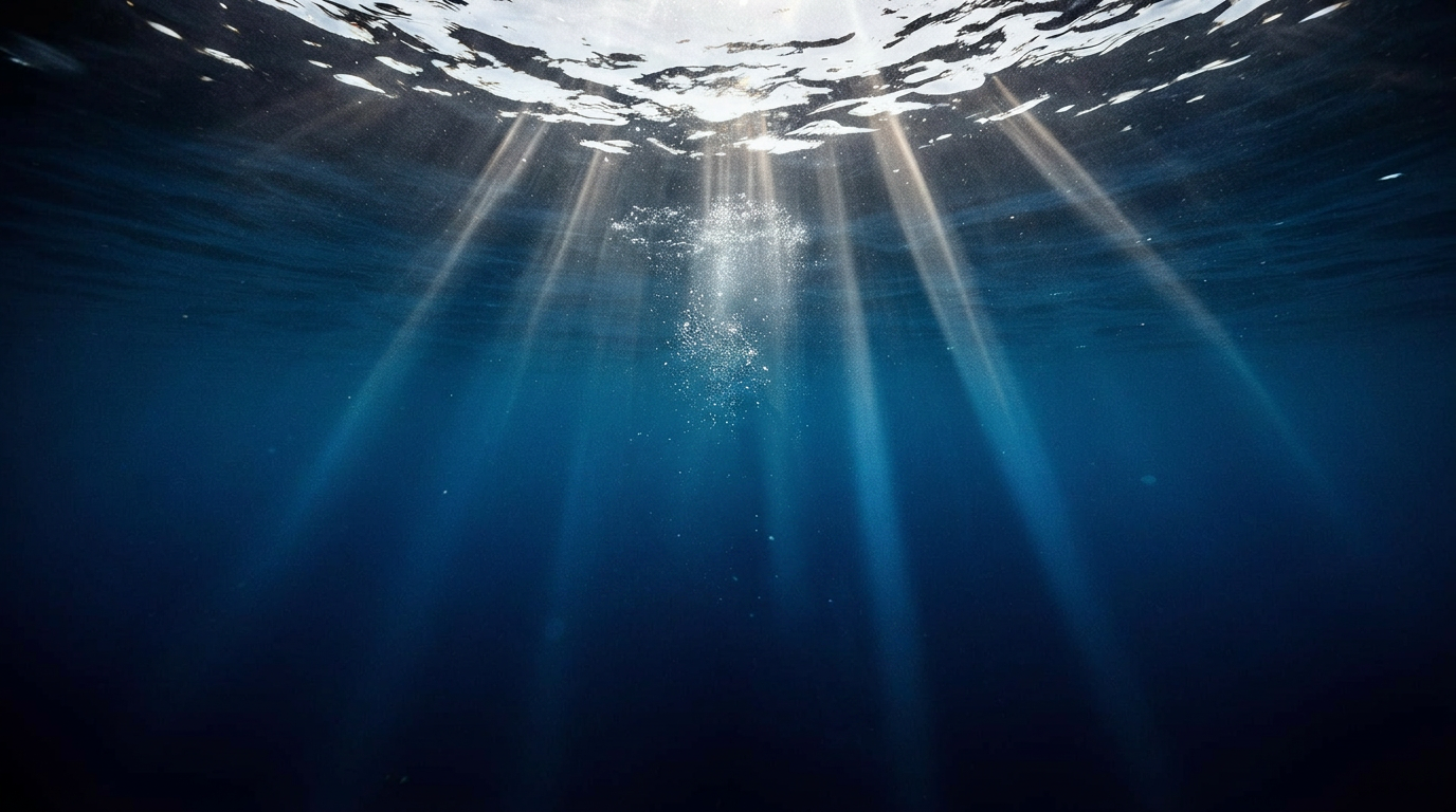 Sunbeams piercing through deep blue Gulf of Mexico water